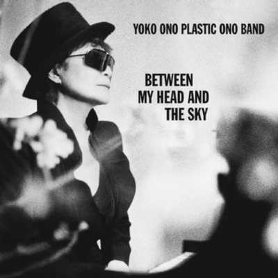 Yoko Onofeel the sand